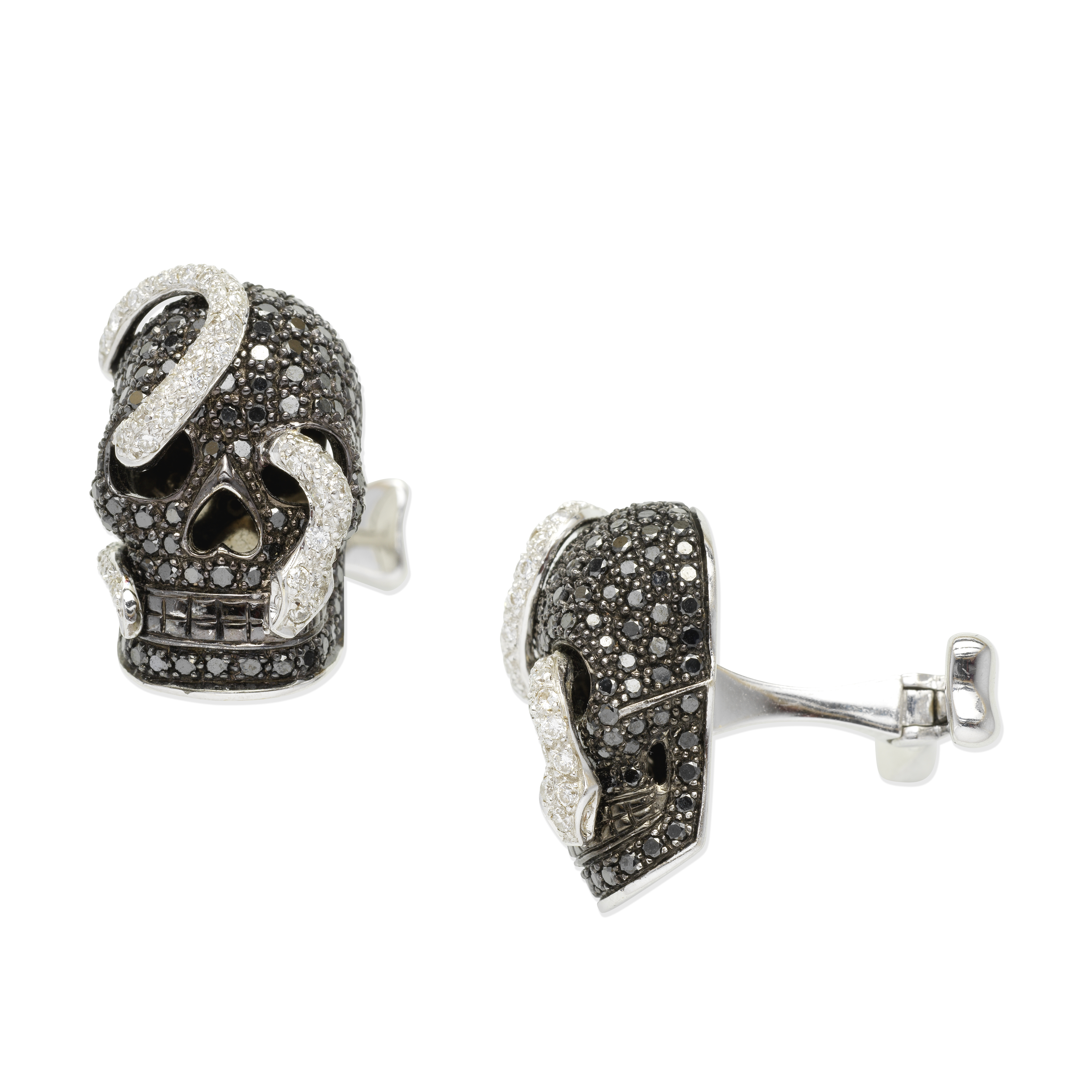 THEO FENNELL: BLACK DIAMOND AND DIAMOND SKULL CUFFLINKS,