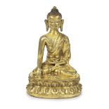 A GILT BRONZE FIGURE OF BUDDHA SHAKYAMUNI Tibet, 14th/15th century