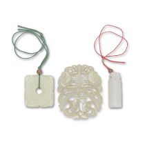 A PALE CELADON JADE 'FU' PLAQUE, A WHITE JADE 'BI' PENDANT AND A WHITE JADE PLUME HOLDER 19th/20...