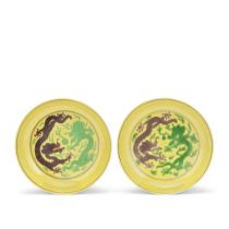 A PAIR OF IMPERIAL YELLOW, GREEN AND AUBERGINE-GLAZED 'DRAGON' DISHES Daoguang seal marks and of...