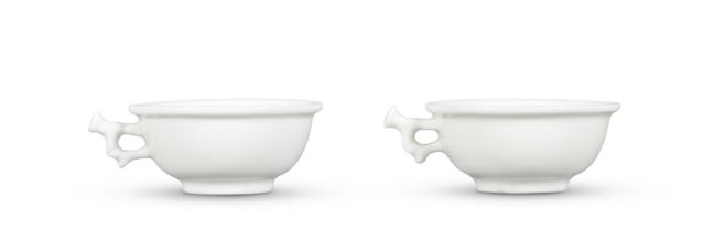 A PAIR OF BLANC-DE-CHINE 'BRANCH-HANDLED' CUPS 17th century (2)