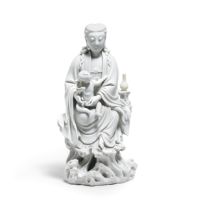 A BLANC-DE-CHINE 'GUANYIN AND CHILD' GROUP 17th/18th century
