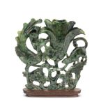 A JADEITE 'PHOENIX, SQUIRREL AND MAGNOLIA' SPILL VASE Late Qing Dynasty