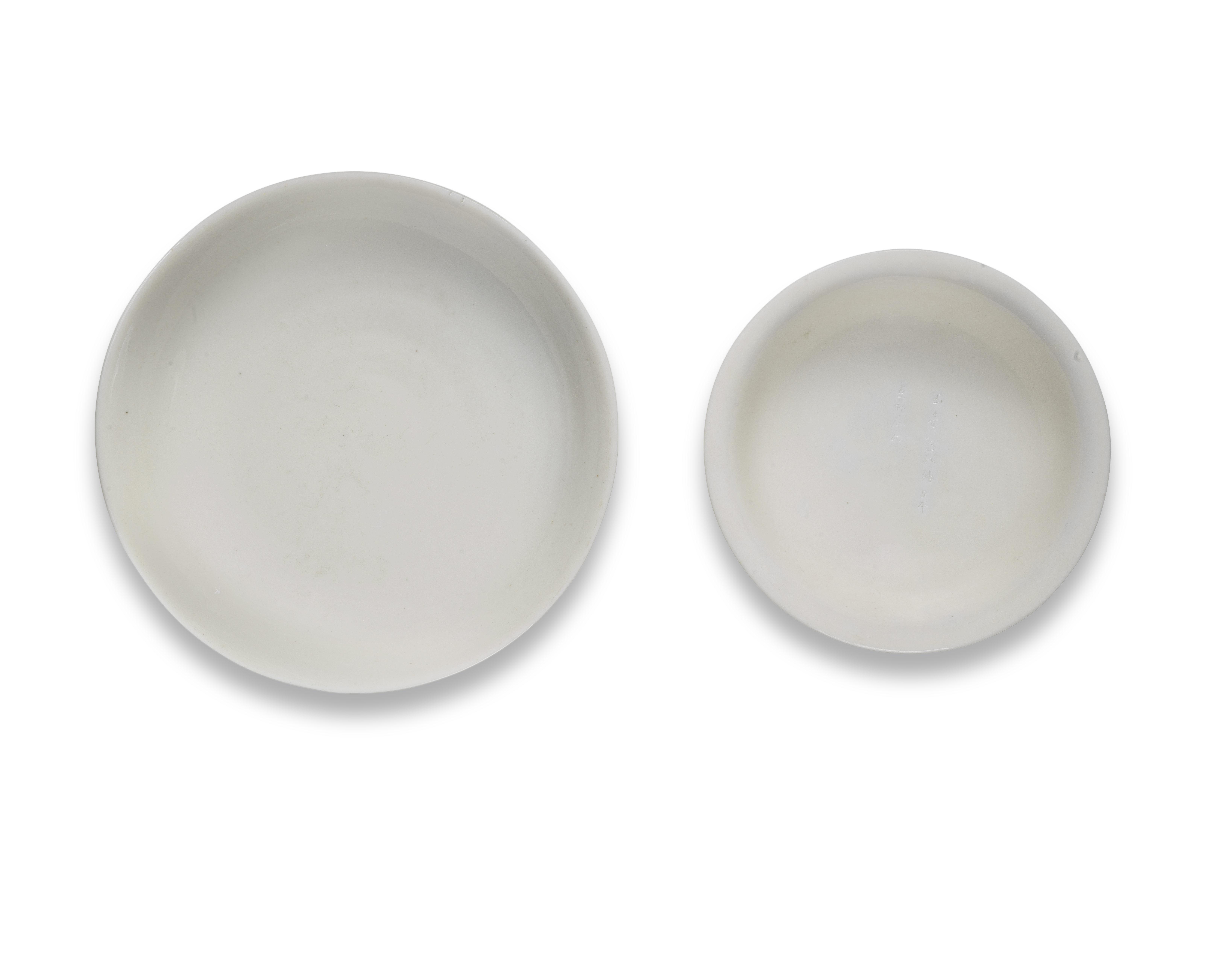 A BLANC-DE-CHINE INSCRIBED BOWL AND A BLANC-DE-CHINE DISH Kangxi (2)