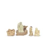 THREE SOAPSTONE FIGURATIVE CARVINGS AND A SOAPSTONE 'BOYS' WASHER 17th /18th century (5)