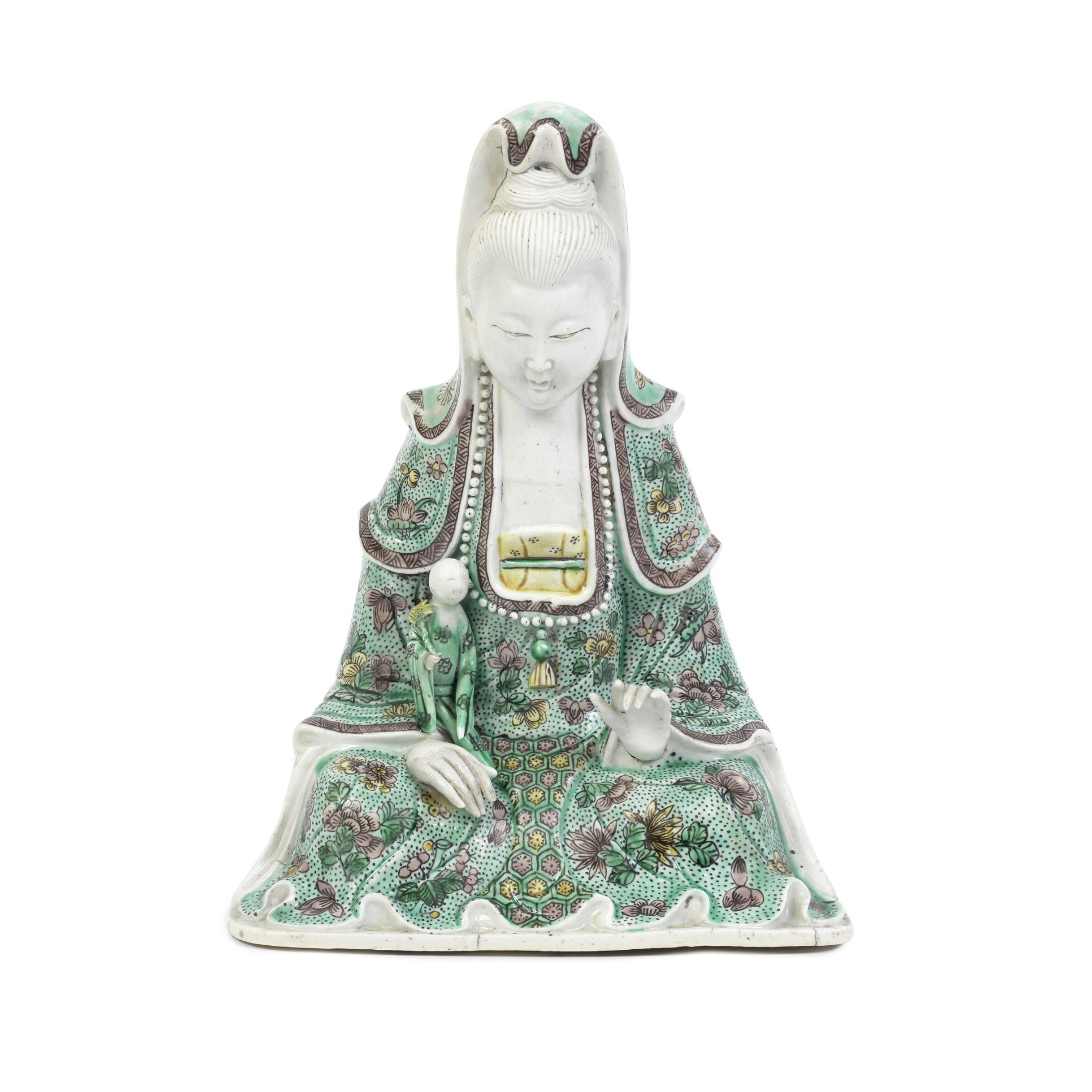 A FAMILLE VERTE BISCUIT SEATED 'GUANYIN AND CHILD' GROUP Kangxi