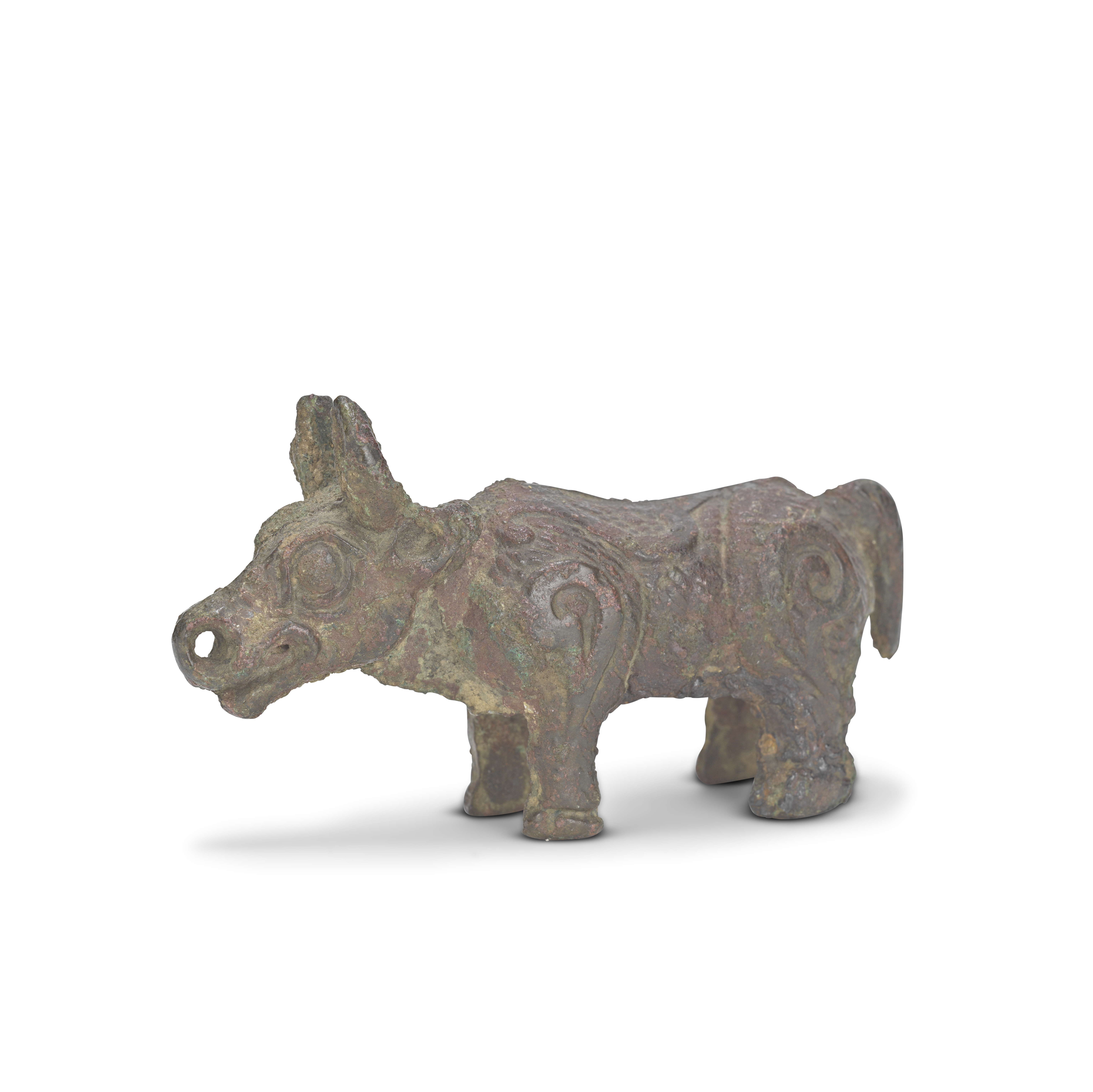 A SMALL BRONZE FIGURE OF A BUFFALO Western Zhou Dynasty