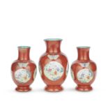 THREE CORAL-GROUND AND GILT-DECORATED FAMILLE ROSE VASES Jiaqing to Daoguang, circa 1820 (6)