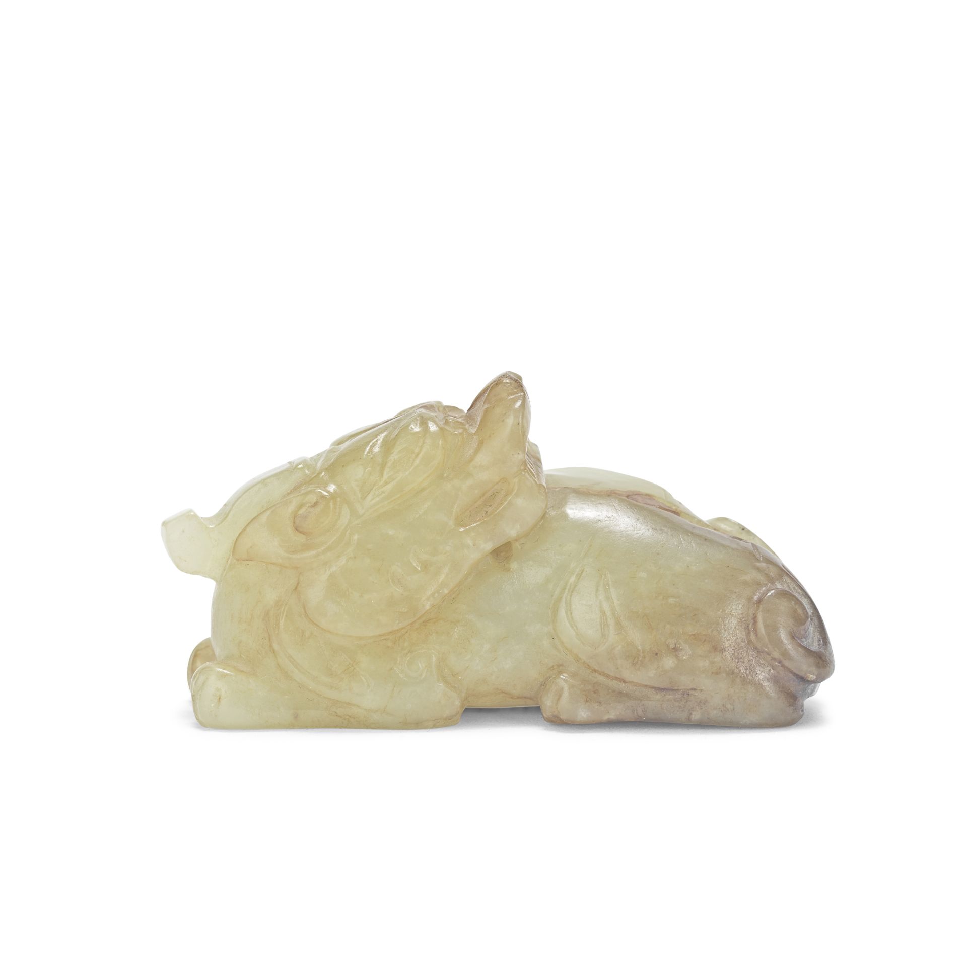 A CREAMY RUSSET JADE CARVING OF A RECUMBENT CHILONG Ming Dynasty