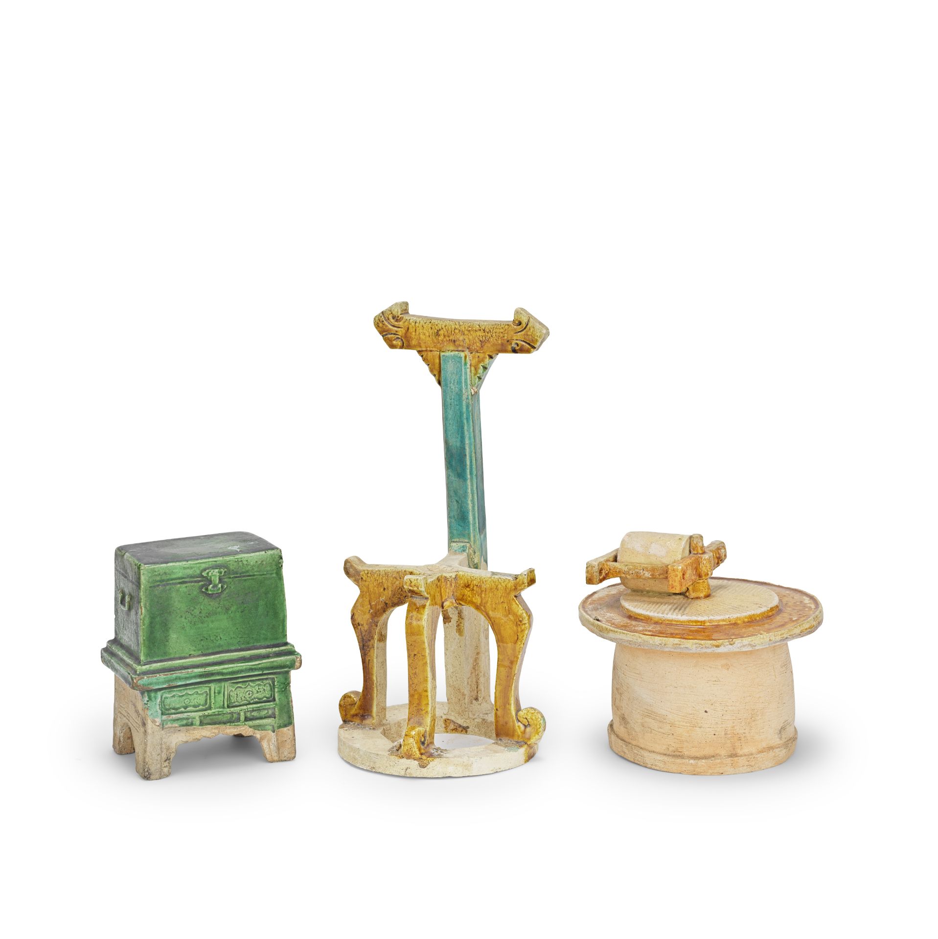 AN OCHRE-GLAZED MODEL OF A MILLSTONE, AN OCHRE AND TURQUOISE-GLAZED WASHSTAND AND A GREEN-GLAZED...