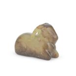 A YELLOW AND RUSSET JADE CARVING OF A RECUMBENT RAM Ming Dynasty