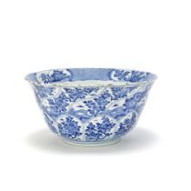 A MOULDED BLUE AND WHITE ARMORIAL BOWL Kangxi