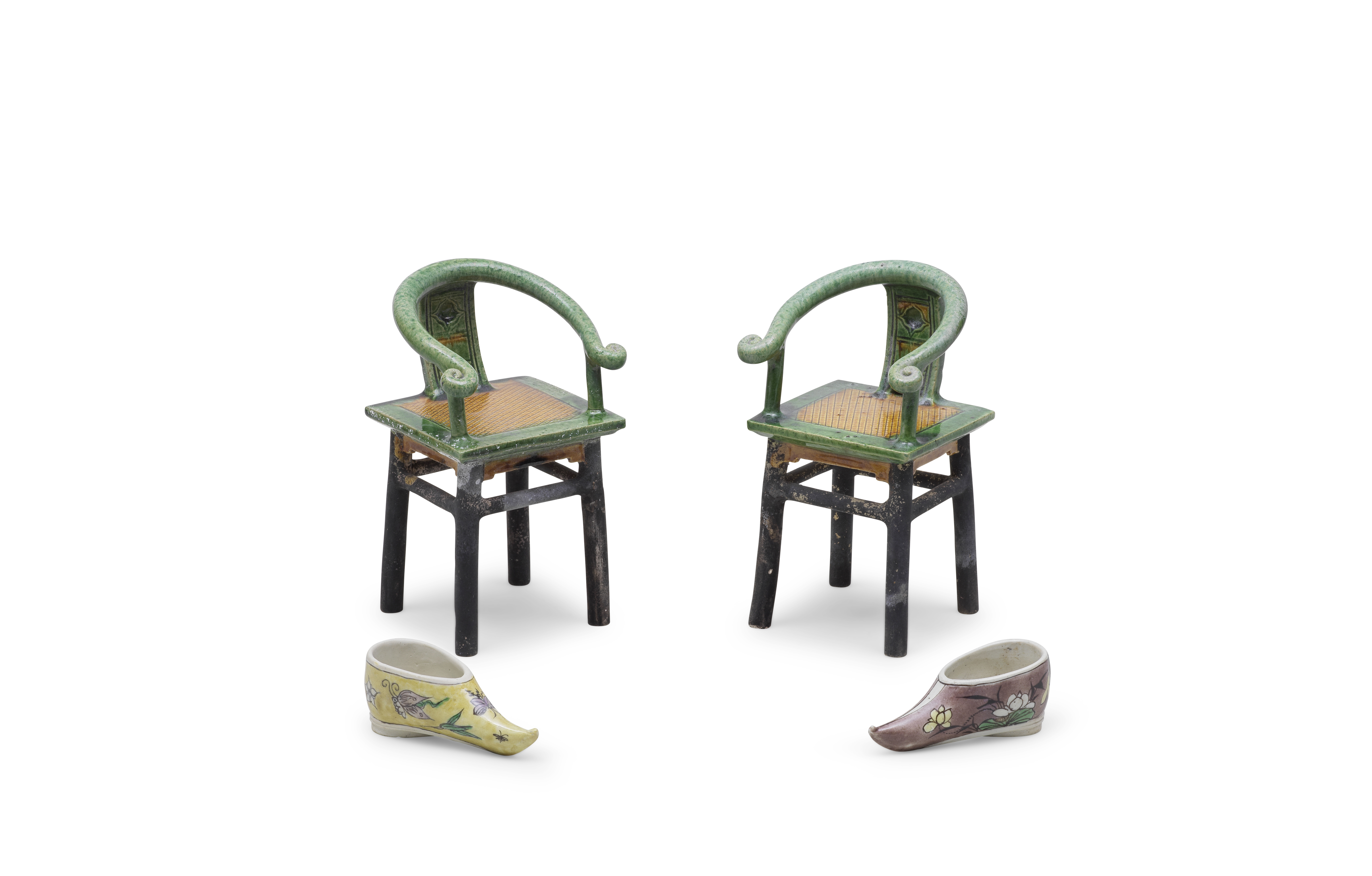 A PAIR OF GREEN AND OCHRE GLAZED MODELS OF HORSESHOE-BACK CHAIRS AND A PAIR OF FAMILLE VERTE BIS...