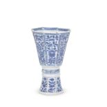 A BLUE AND WHITE OCTAGONAL STEM CUP Kangxi