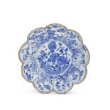 A BLUE AND WHITE PETAL-RIM SAUCER DISH Kangxi