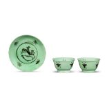 A PAIR OF GREEN AND BLACK GLAZED TEA BOWLS AND A SAUCER Kangxi (3)
