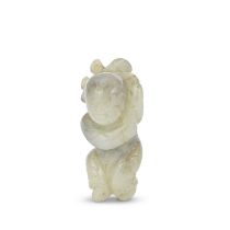 A MOTTLED JADE CARVING OF A BOY Ming Dynasty