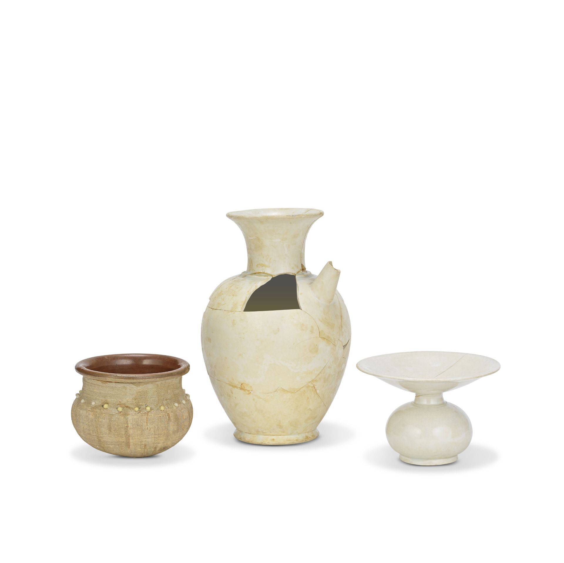 A RARE XINGYAO EWER, A WHITE-GLAZED ZHADOU AND A RICE MEASURE JAR Tang to Yuan Dynasty (3)