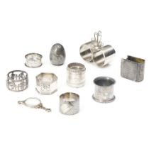 EIGHT SILVER-PLATED NAPKIN RINGS, A PEPPER SHAKER, AND SPECTACLES