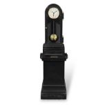 An interesting early 20th century black japanned cast metal patent timepiece the dial signed Sir...