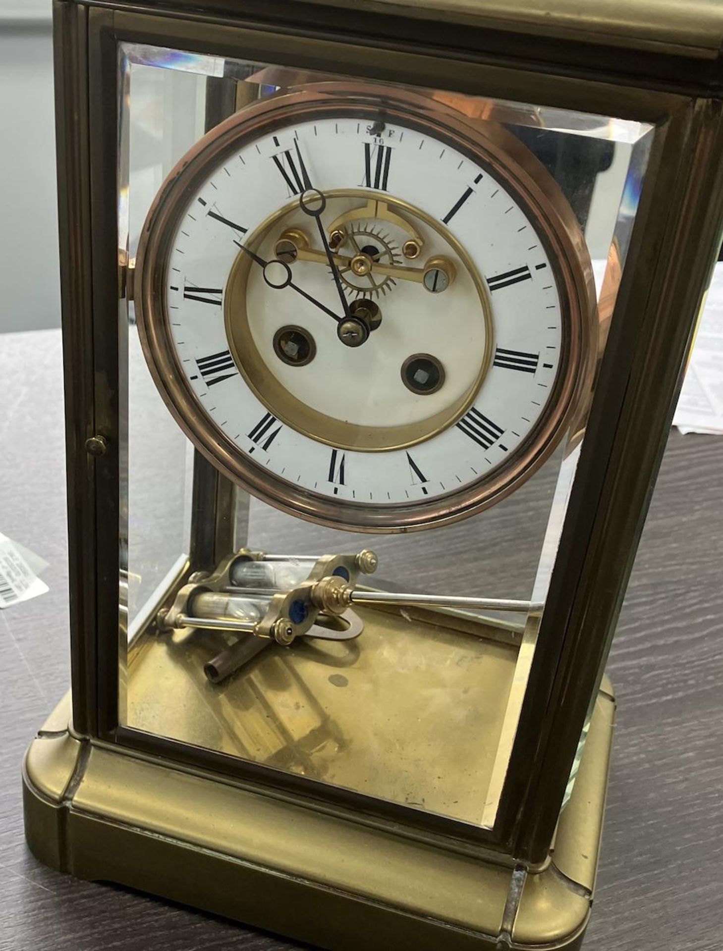 A late 19th/early 20th century French brass four glass clock the movement stamped A*B - Image 2 of 2