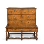 A late 17th/early 18th century elm and boxwood line-inlaid chest on stand