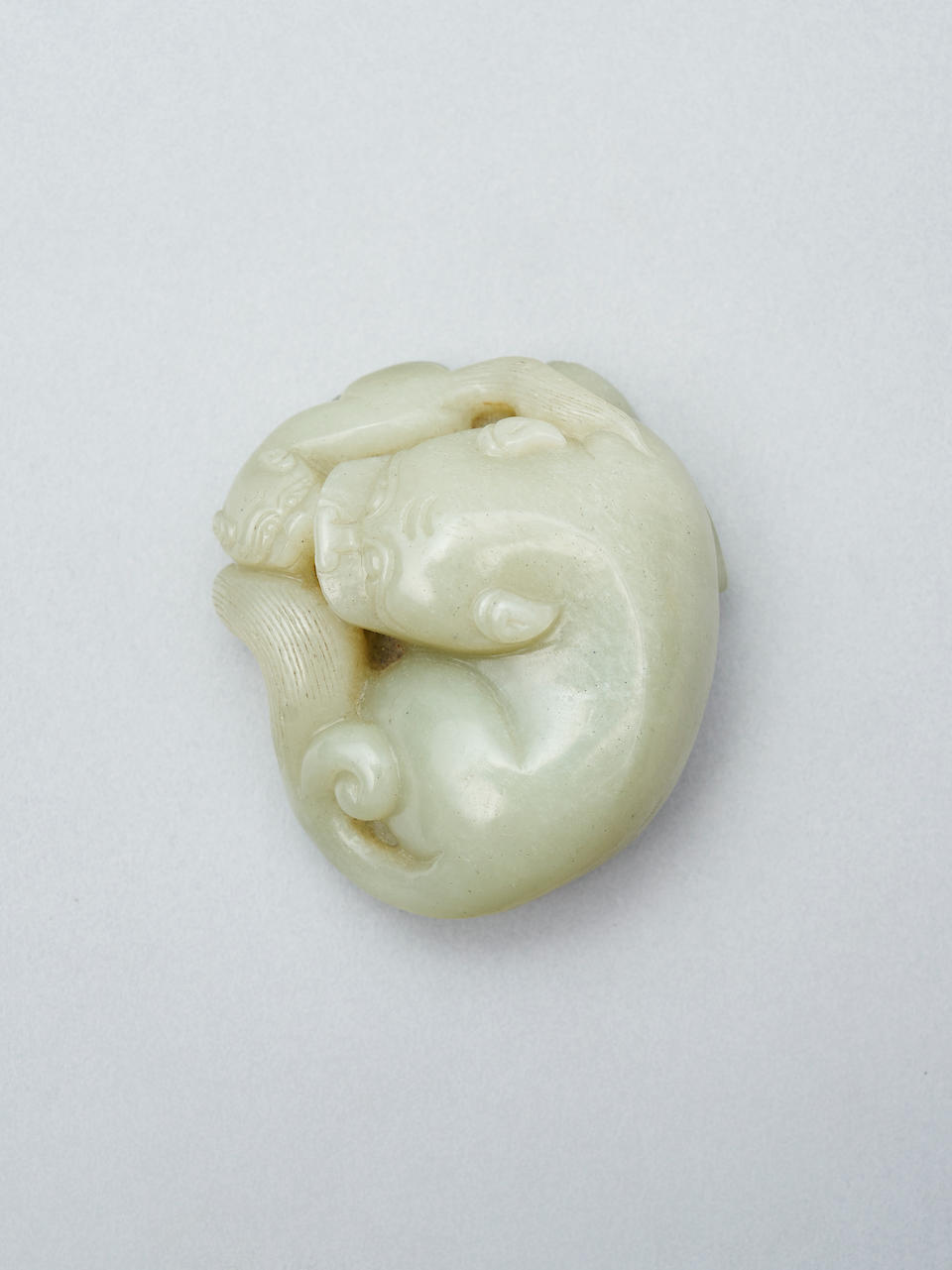 A celadon jade figure group of lion and cub 19th/ 20th century