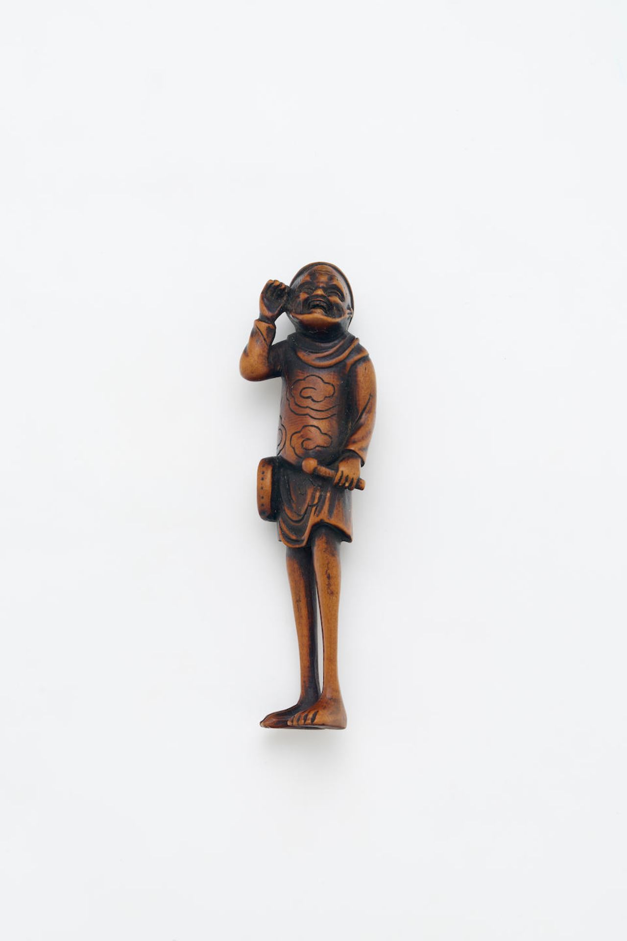A WOOD NETSUKE OF A FOREIGNER Meiji Period, 19th Century