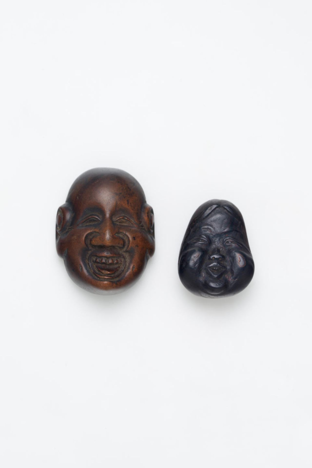 TWO WOOD MASK-THEME NETSUKE Edo Period, 19th Century (2)