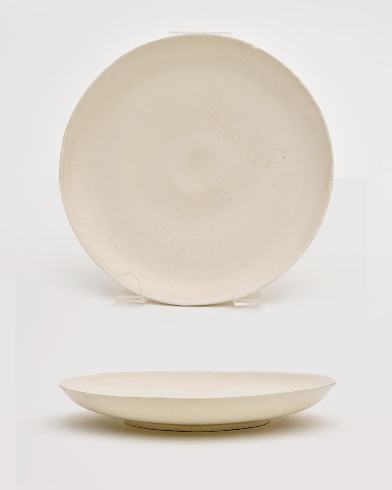 A ding-type white-glazed saucer dish Probably 12th/ 13th century