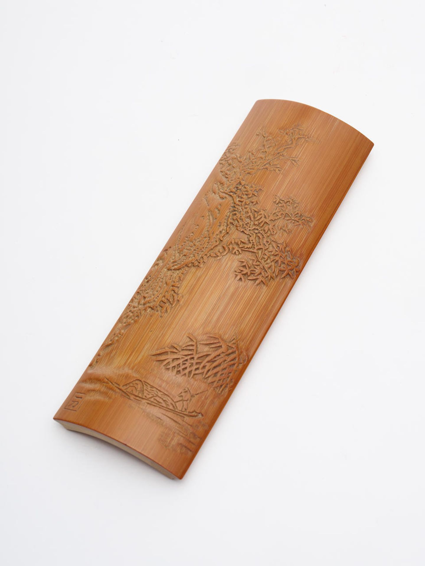 A bamboo 'landscape' wrist rest 19th/ 20th century