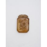 An agate 'child and lingzhi' plaque 19th/ 20th century