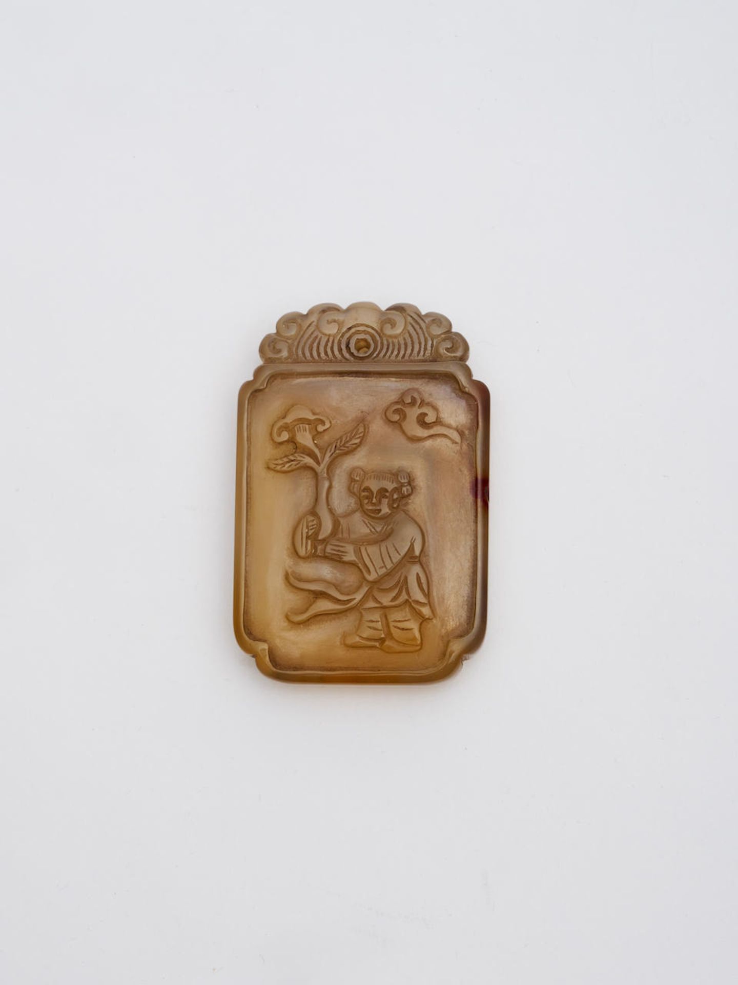 An agate 'child and lingzhi' plaque 19th/ 20th century