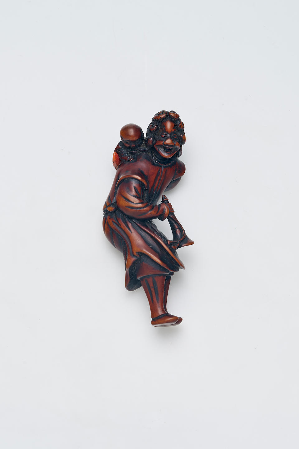 A WOOD NETSUKE OF A NANBANJIN Edo Period, 18th/19th Century