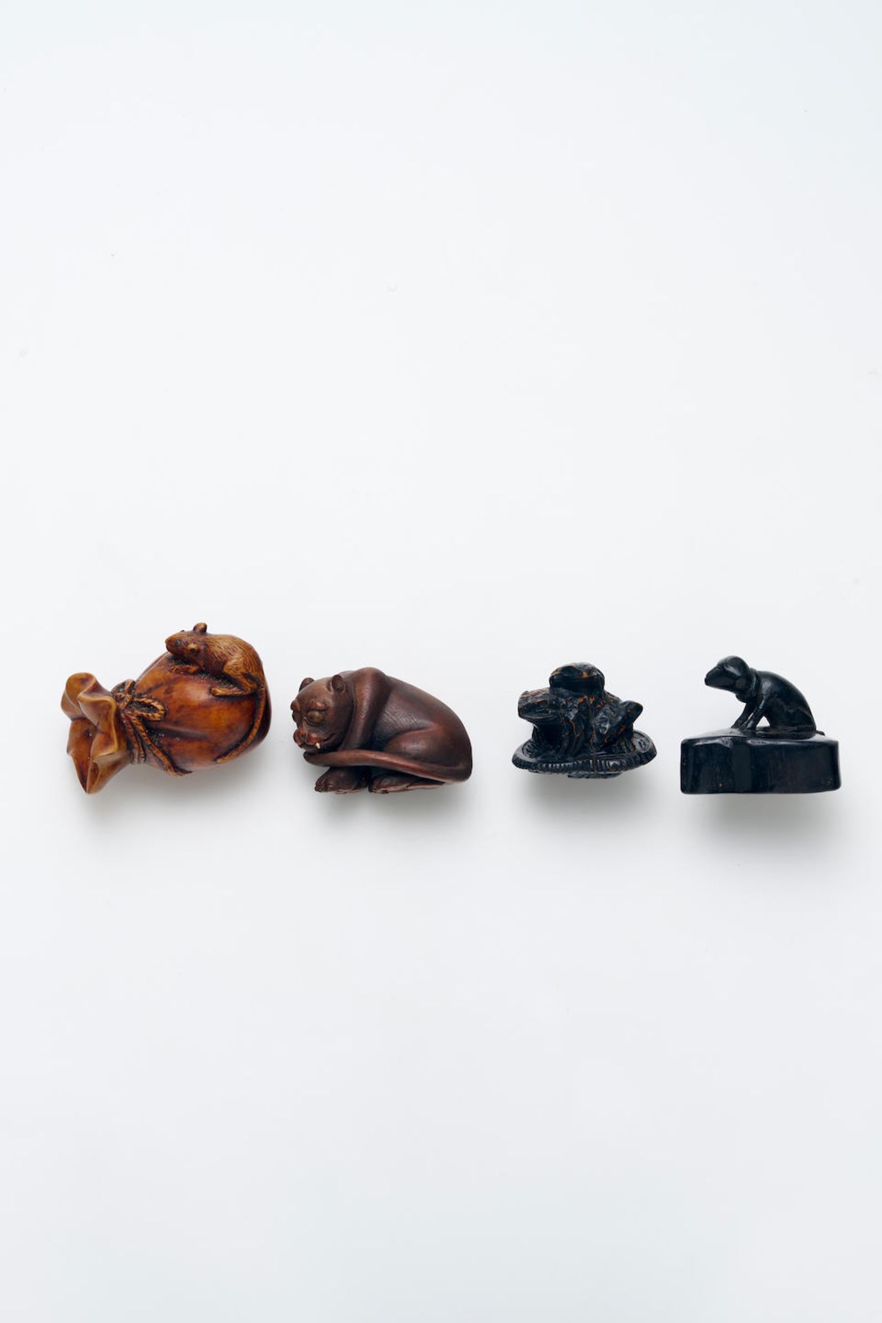 FOUR WOODEN ANIMAL THEME NETSUKE Meiji Period and later, 19th/20th Century (4)