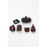 FOUR WOODEN PLANT AND FUNGUS THEME NETSUKE AND HORN AUBERGINE ROSEWOOD FRUIT AND VEGETABLE FIGUR...