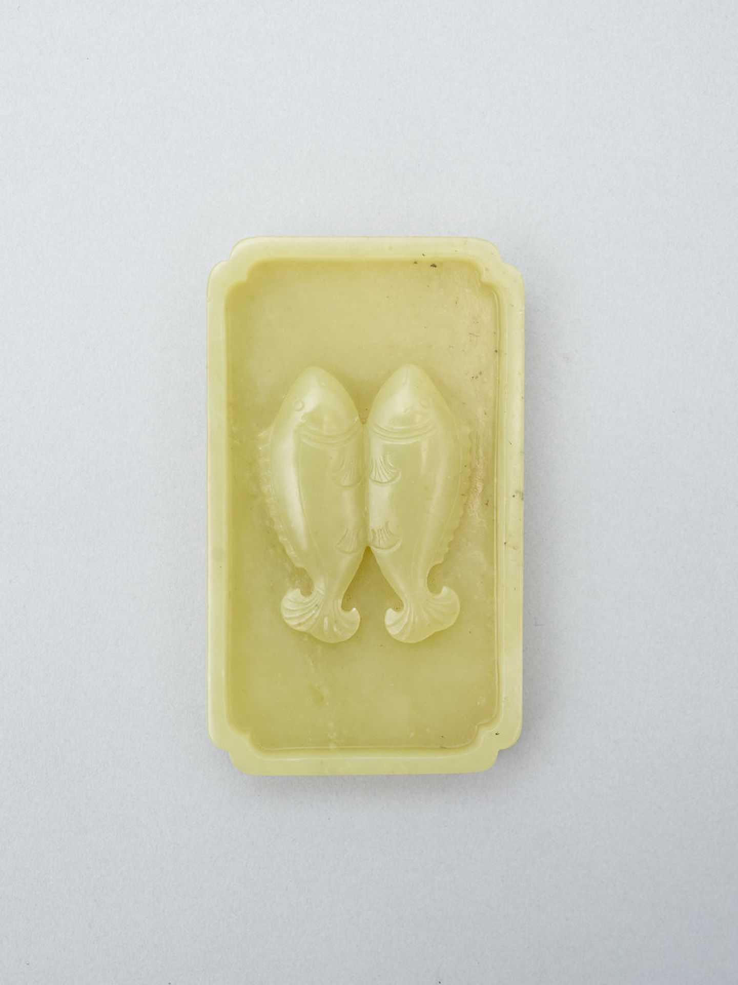 A yellow jade 'double fish' washer Qing dynasty