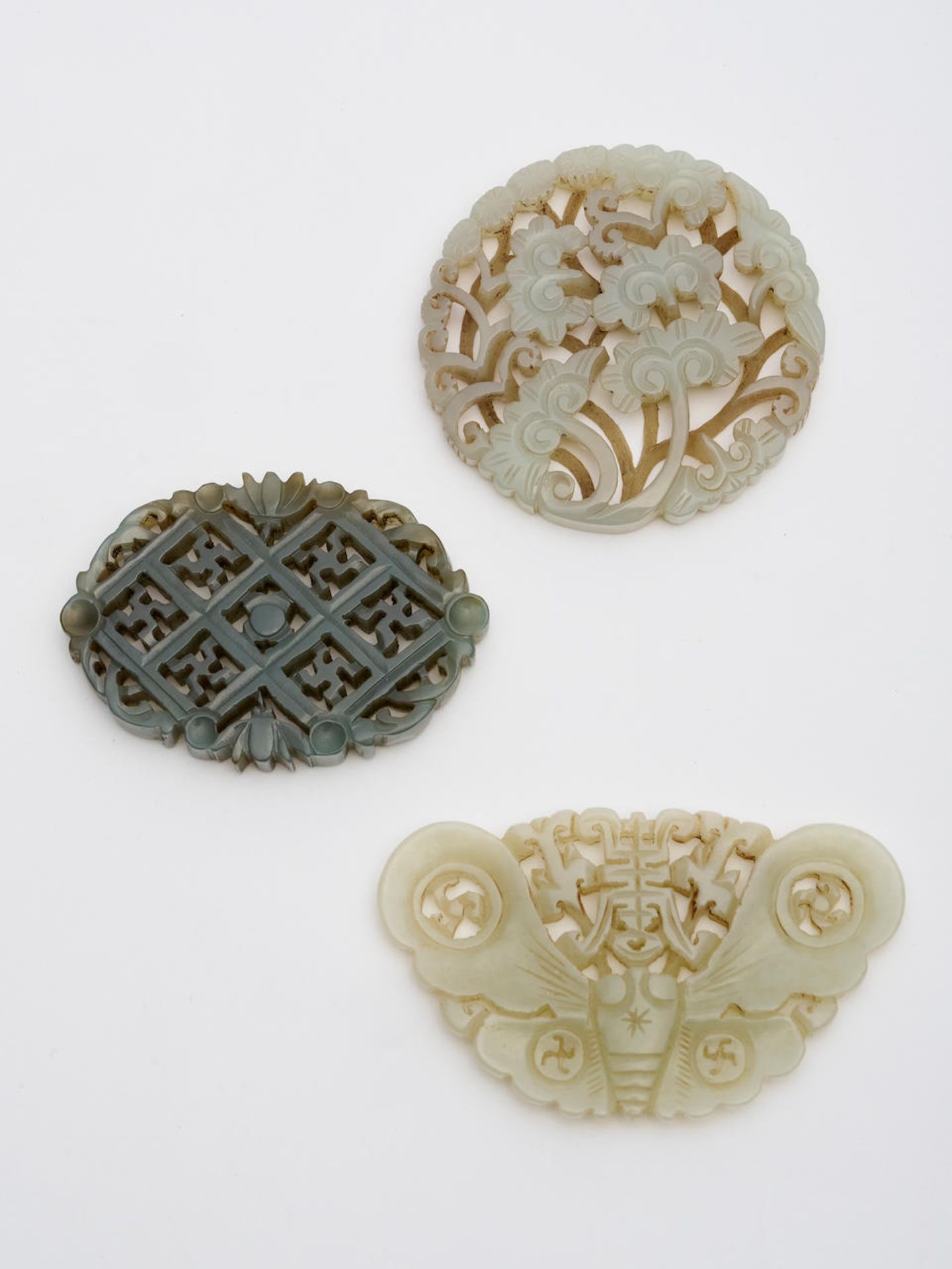 Three reticulated jade plaques 19th/ 20th century (3)