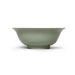 A PALE-GREEN-GLAZED RELIEF-MOULDED BOWL Yongzheng six-character mark and of the period