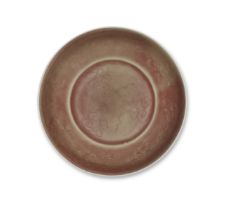 A RED-GLAZED INCISED 'CLOUDS AND CHILONG' SAUCER-DISH Xuande six-character mark, Kangxi