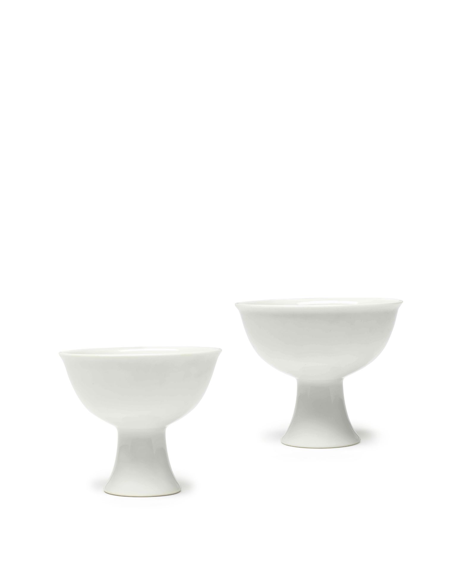 A PAIR OF WHITE-GLAZED 'PHOENIX' STEM CUPS Yongle four-character marks, Qing Dynasty (2)