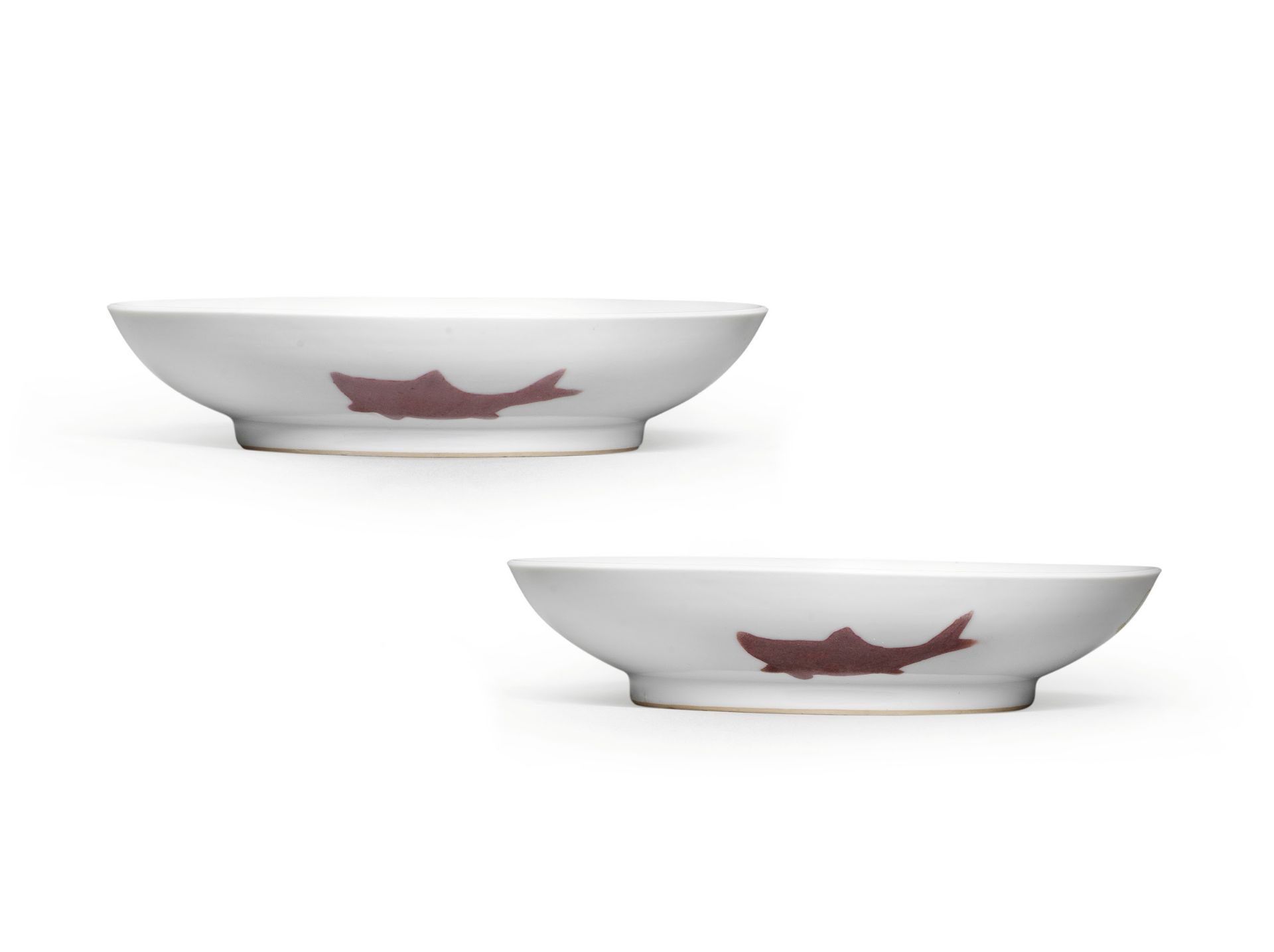 A PAIR OF COPPER-RED 'THREE FISH' DISHES Yongzheng six-character marks and of the period (2)