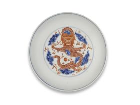 A BLUE AND IRON-RED 'DRAGON' SAUCER DISH Qianlong seal mark and of the period