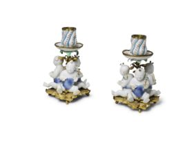 A PAIR OF EUROPEAN-ORMOLU-MOUNTED CANDLEHOLDERS WITH CHINESE PORCELAIN 'BOYS' The Chinese porcel...