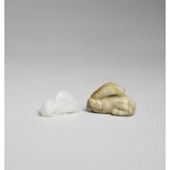 A SMALL WHITE JADE CARVING OF A HORSE AND A CELADON AND RUSSET JADE CARVING OF A HORSE Qing Dyn...