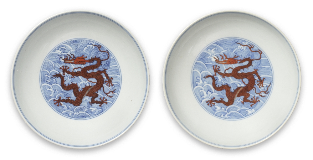 A RARE PAIR OF BLUE AND WHITE IRON-RED ENAMELLED 'DRAGON' DISHES Qianlong seal marks and of the ...