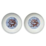 A RARE PAIR OF BLUE AND WHITE IRON-RED ENAMELLED 'DRAGON' DISHES Qianlong seal marks and of the ...