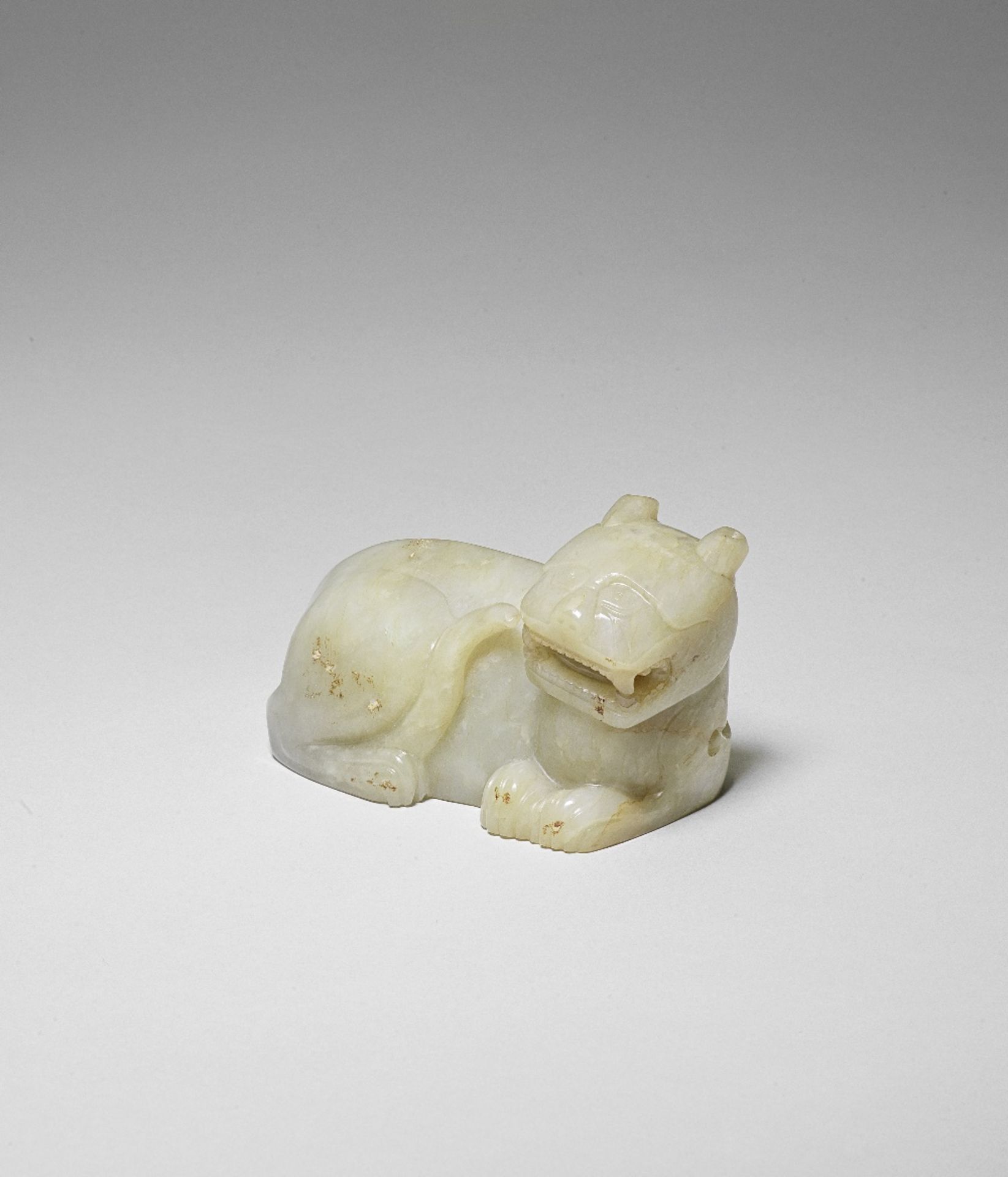 A PALE GREEN JADE CARVING OF A TIGER Song/Yuan Dynasty or later (2)