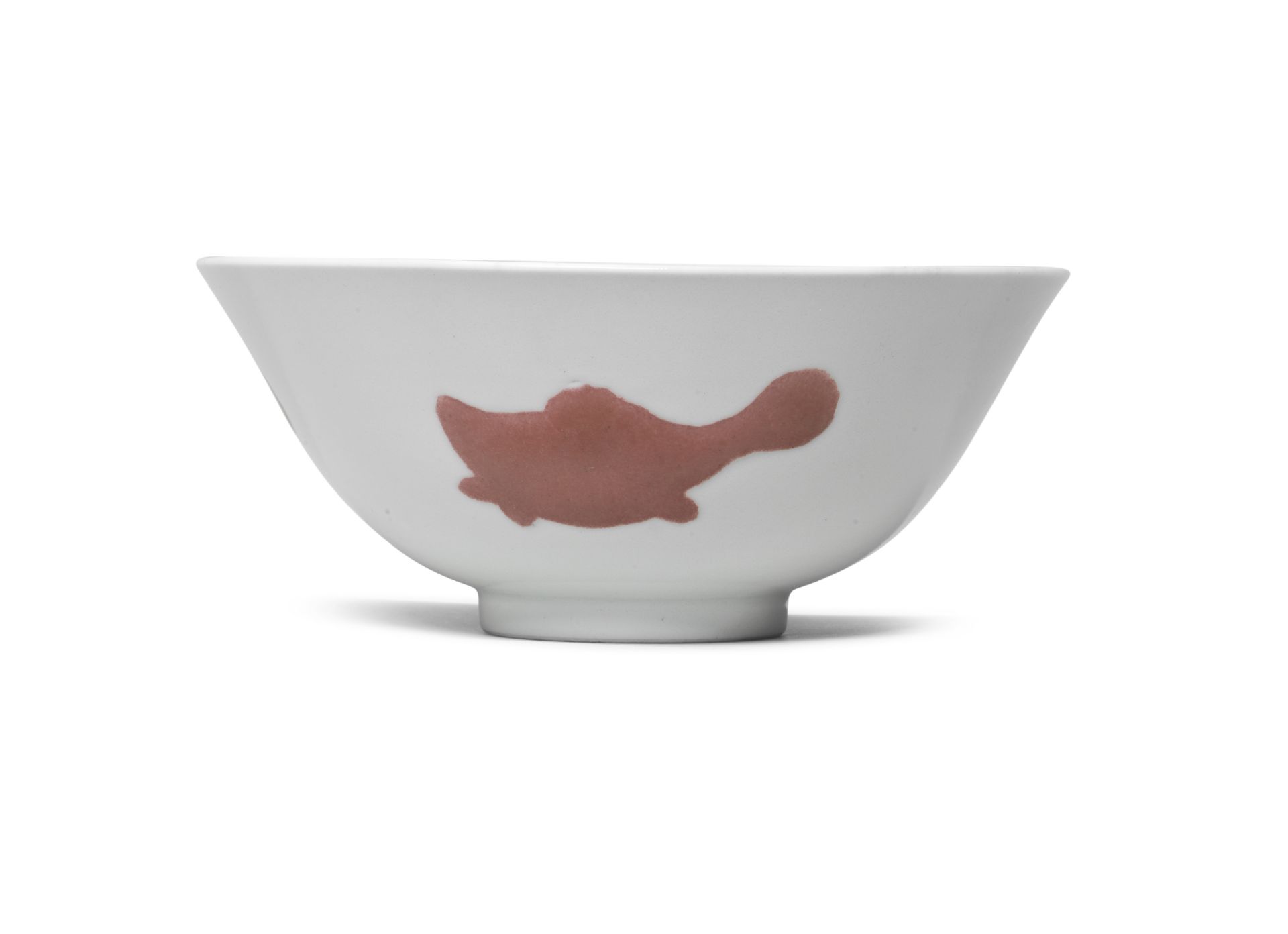 A COPPER RED 'THREE FISH' BOWL Yongzheng six-character mark and of the period