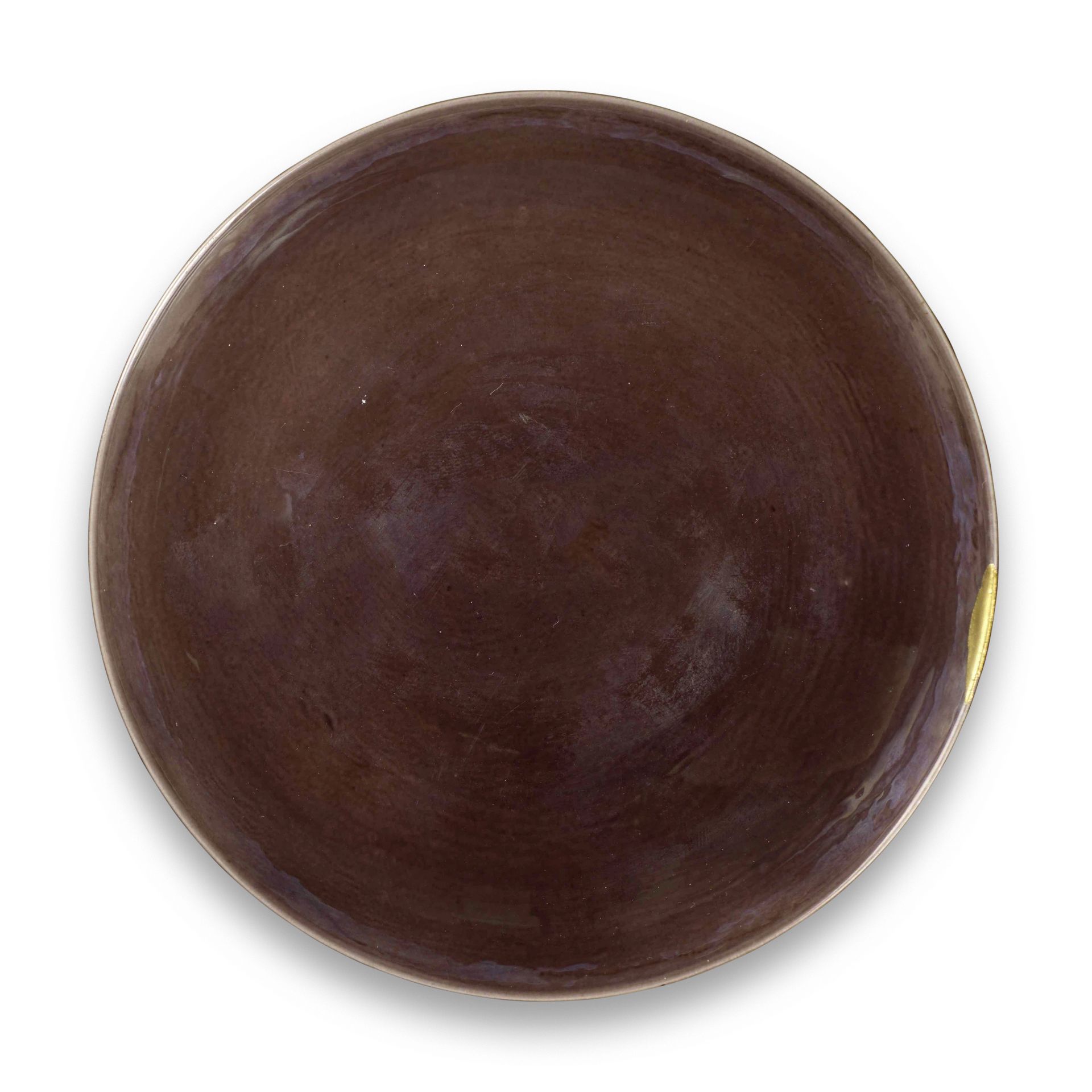 AN AUBERGINE-GLAZED 'EIGHT BUDDHIST EMBLEMS' SAUCER DISH Yongzheng six-character mark and of the...